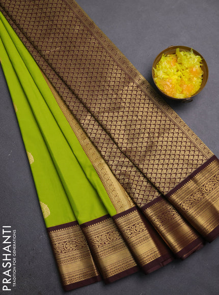 Semi kanchipuram silk saree lime green and coffee brown with zari woven buttas and zari woven korvai border