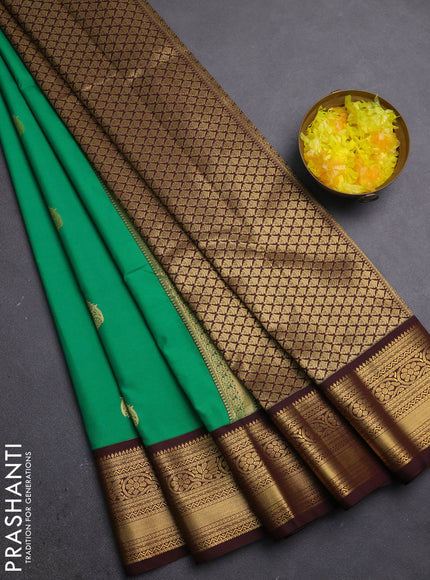 Semi kanchipuram silk saree green and coffee brown with zari woven buttas and zari woven korvai border