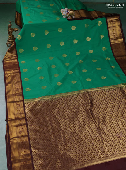 Semi kanchipuram silk saree green and coffee brown with zari woven buttas and zari woven korvai border