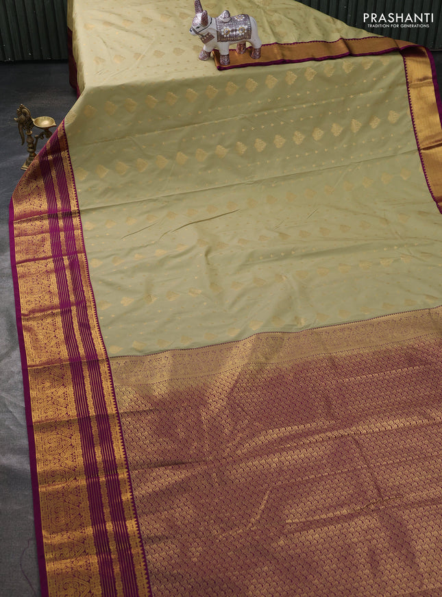 Semi kanchipuram silk saree pista green and magenta pink with allover zari woven buttas and long zari woven border