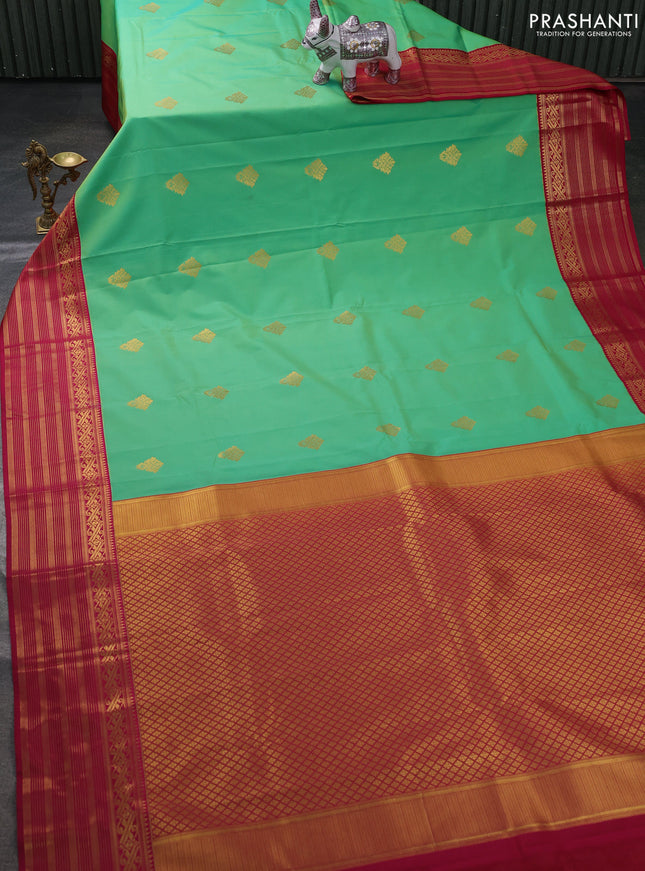 Semi kanchipuram silk saree teal green and magenta pink with zari woven buttas and zari woven border