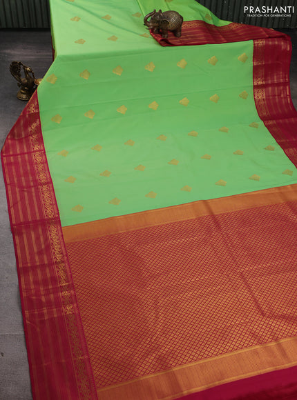Semi kanchipuram silk saree fluorescent green and magenta pink with zari woven buttas and zari woven border