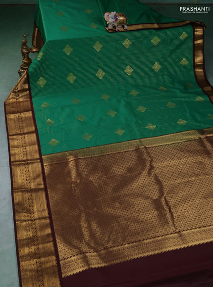 Semi kanchipuram silk saree green and coffee brown with allover zari weaves & buttas and zari woven border