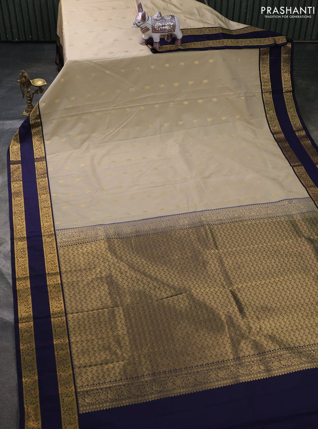 Semi kanchipuram silk saree beige and navy blue with allover zari woven buttas and rettapet zari woven border