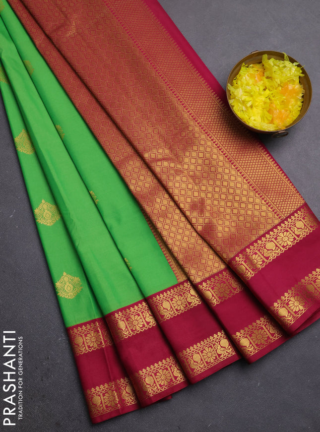 Semi kanchipuram silk saree light green and magenta pink with zari woven buttas and rettapet zari woven border