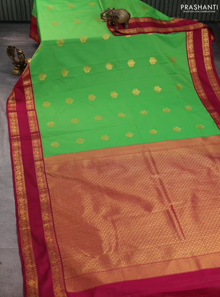 Semi kanchipuram silk saree light green and magenta pink with zari woven buttas and rettapet zari woven border