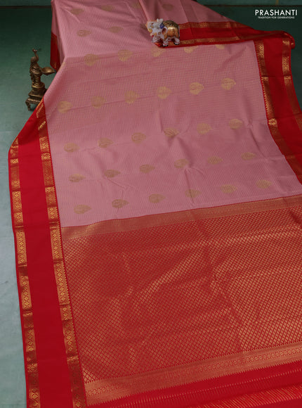 Semi kanchipuram silk saree peach shade and red with allover zari checks & buttas and rettapet zari woven border