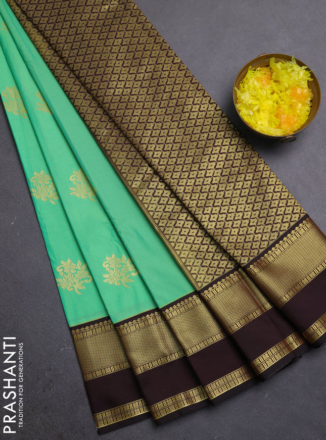 Semi kanchipuram silk saree light green and coffee brown with zari woven buttas and rettapet zari woven border