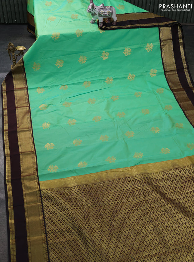 Semi kanchipuram silk saree light green and coffee brown with zari woven buttas and rettapet zari woven border