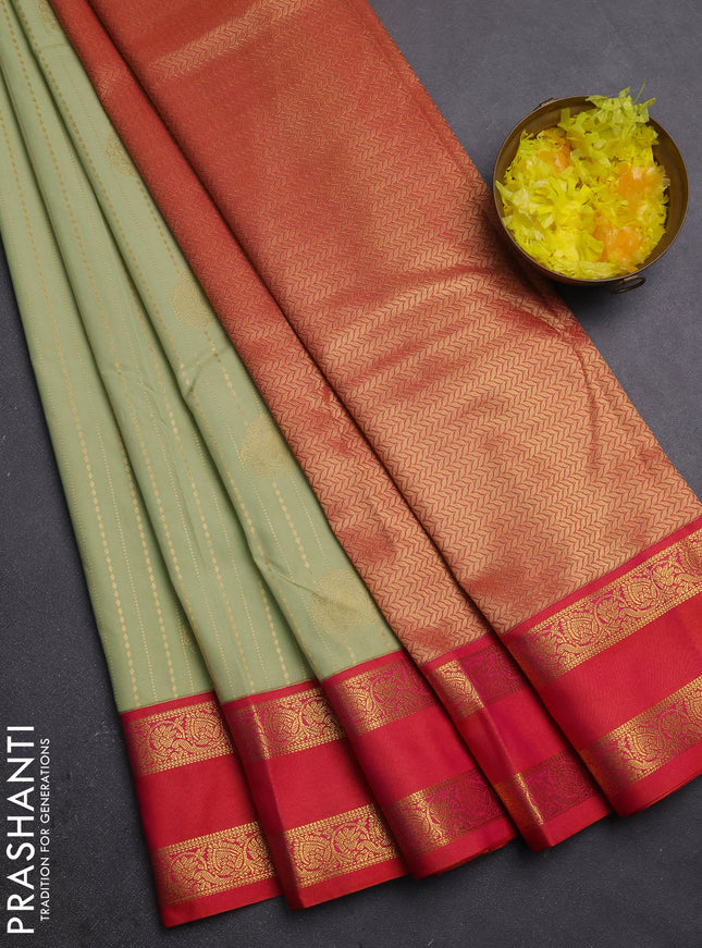Semi kanchipuram silk saree pista green and orange with allover zari weaves & buttas and rettapet zari woven border