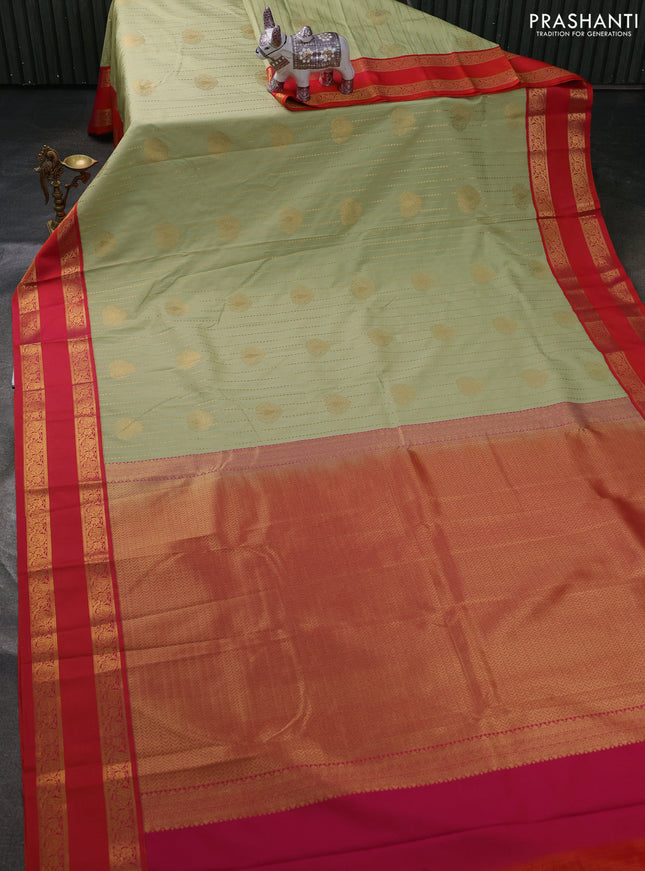 Semi kanchipuram silk saree pista green and orange with allover zari weaves & buttas and rettapet zari woven border