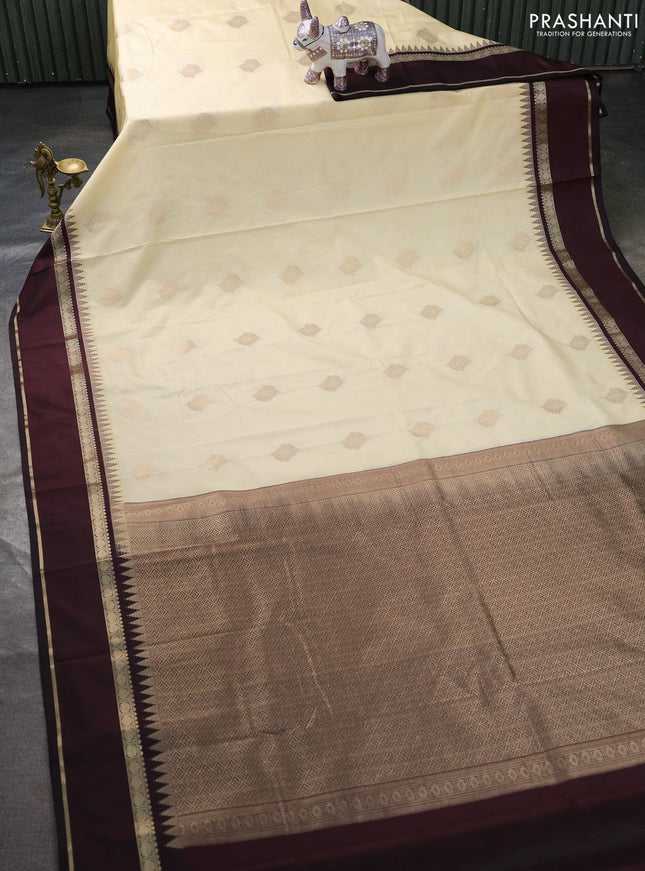 Semi kanchipuram silk saree cream and deep maroon with zari woven buttas and temple design rettapet zari woven border