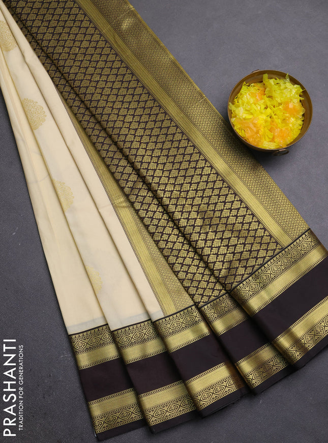 Semi kanchipuram silk saree cream and black with zari woven buttas and rettapet zari woven border