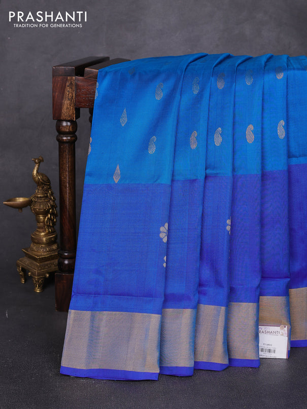 Pure uppada silk saree cs blue and blue with allover silver & zari woven buttas and parrot design zari woven border