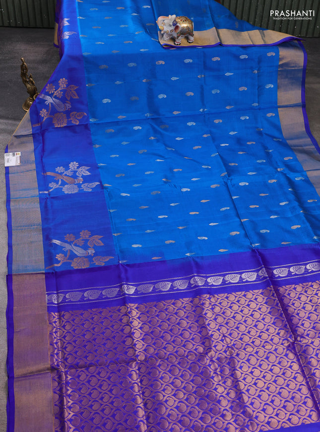 Pure uppada silk saree cs blue and blue with allover silver & zari woven buttas and parrot design zari woven border