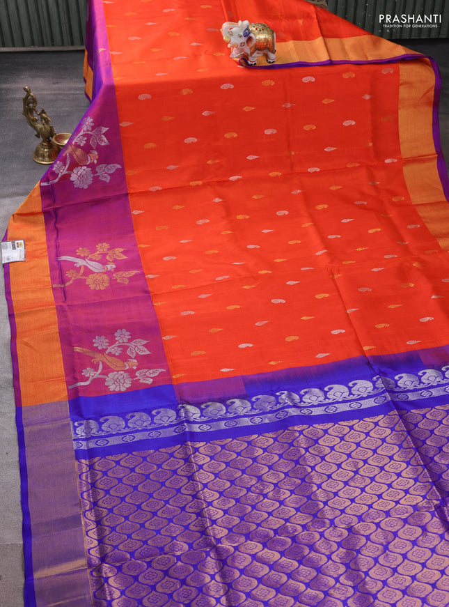 Pure uppada silk saree orange and royal blue with allover silver & zari woven buttas and parrot design zari woven border