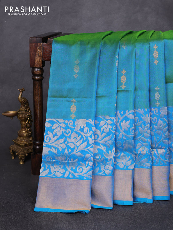Pure uppada silk saree dual shade of teal green and teal blue with allover silver & zari woven buttas and long zari woven border