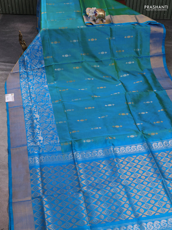 Pure uppada silk saree dual shade of teal green and teal blue with allover silver & zari woven buttas and long zari woven border
