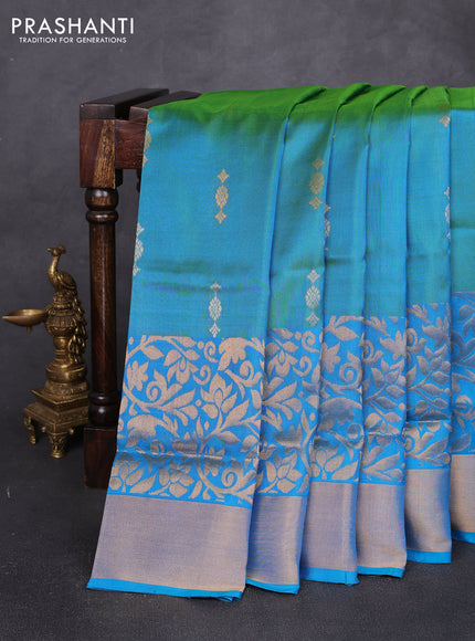 Pure uppada silk saree dual shade of teal green and teal blue with allover silver & zari woven buttas and long zari woven border