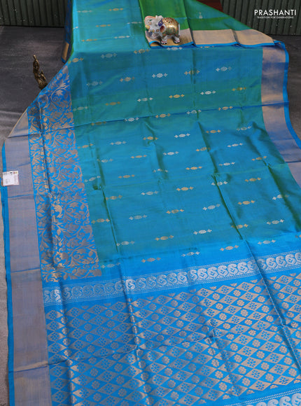 Pure uppada silk saree dual shade of teal green and teal blue with allover silver & zari woven buttas and long zari woven border