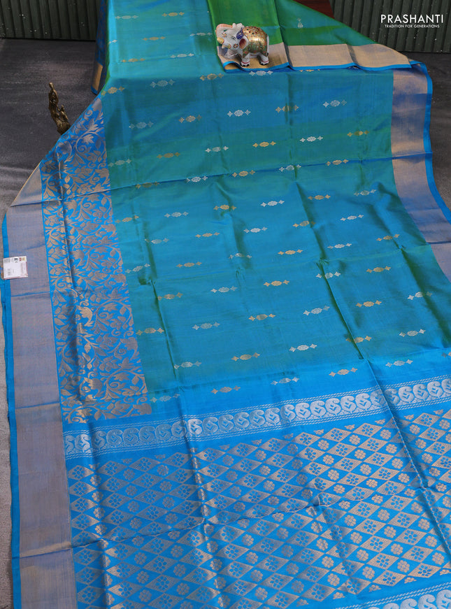 Pure uppada silk saree dual shade of teal green and teal blue with allover silver & zari woven buttas and long zari woven border
