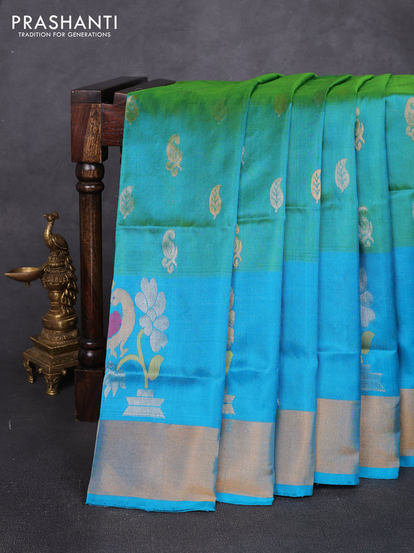 Pure uppada silk saree dual shade of teal green and teal blue with allover silver & zari woven buttas and peacock design zari woven border