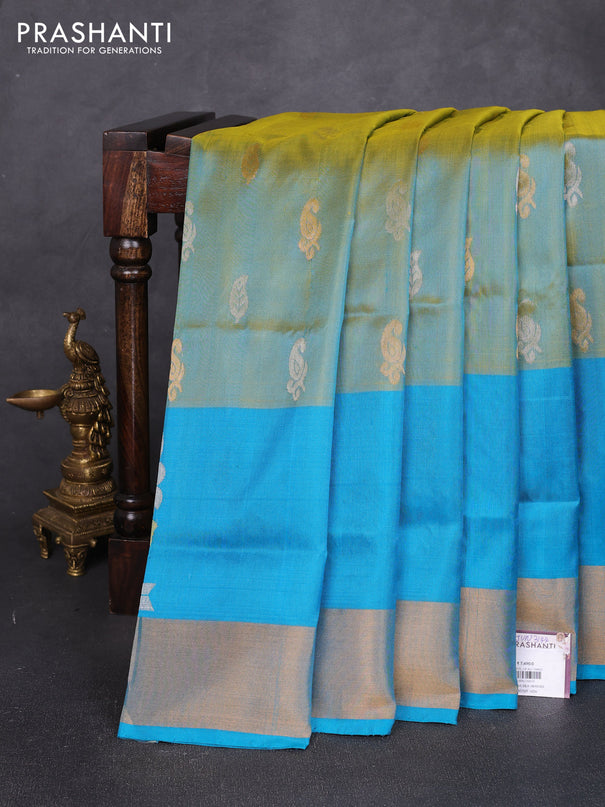 Pure uppada silk saree dual shade of greenish yellow and teal blue with allover silver & zari woven buttas and peacock zari woven butta border