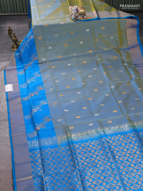 Pure uppada silk saree dual shade of bluish yellow and cs blue with allover silver & zari woven buttas and zari woven butta border