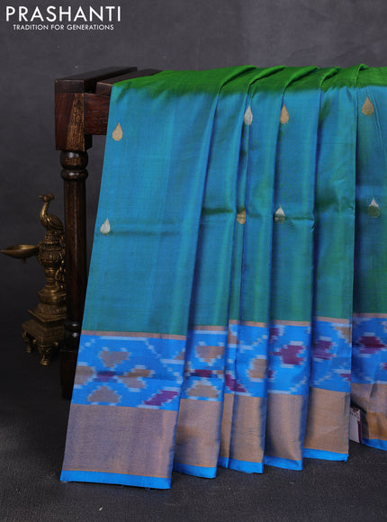 Pure uppada silk saree dual shade of blueish green and cs blue with allover silver & zari woven buttas and ikat woven zari border
