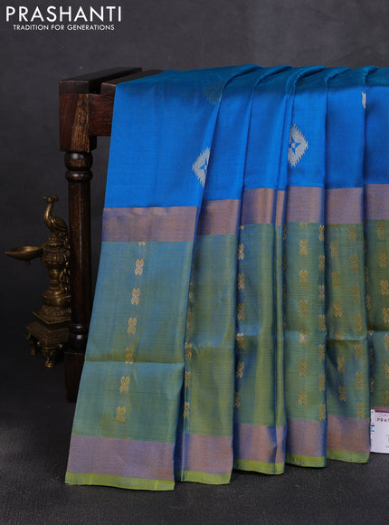 Pure uppada silk saree cs blue and dual shade of light green with allover zari woven buttas and long zari woven butta border