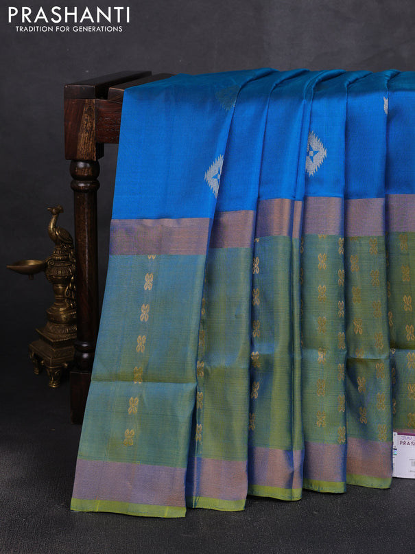 Pure uppada silk saree cs blue and dual shade of light green with allover zari woven buttas and long zari woven butta border