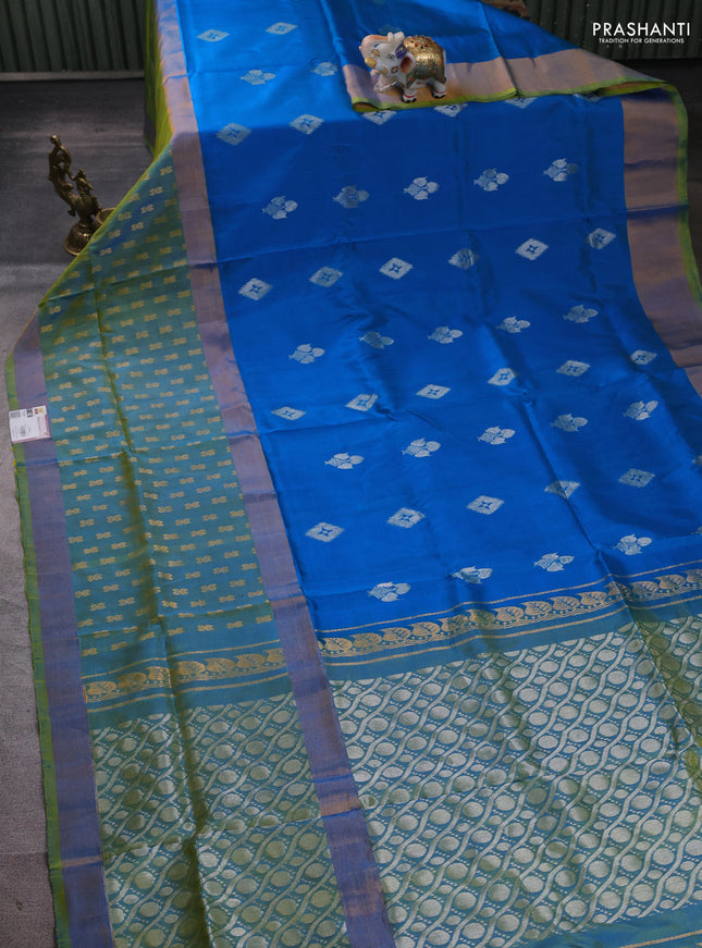 Pure uppada silk saree cs blue and dual shade of light green with allover zari woven buttas and long zari woven butta border