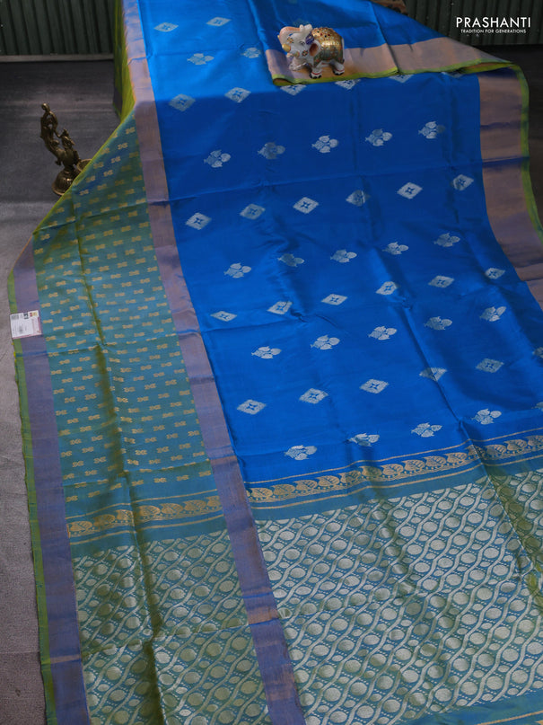 Pure uppada silk saree cs blue and dual shade of light green with allover zari woven buttas and long zari woven butta border