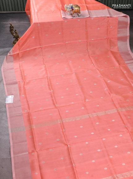 Pure uppada silk saree peach orange with allover zari woven buttas and zari woven border
