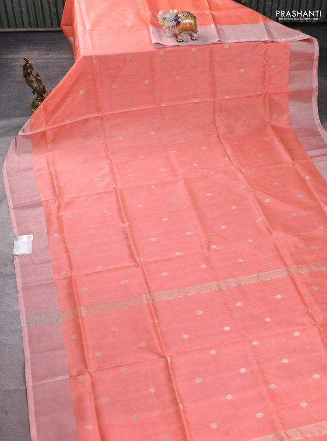 Pure uppada silk saree peach orange with allover zari woven buttas and zari woven border