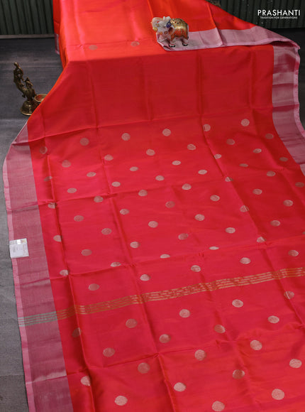 Pure uppada silk saree dual shade of pinkish orange with allover silver coin buttas and zari woven border