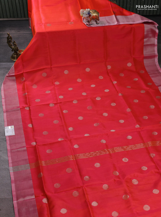 Pure uppada silk saree dual shade of pinkish orange with allover silver coin buttas and zari woven border