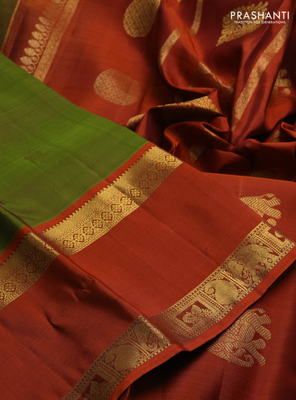Pure kanchipuram silk saree mehendi green and rust shade with zari woven buttas and long rettapet zari woven border