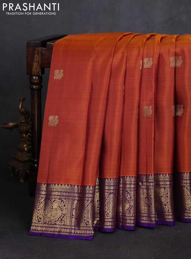 Pure kanchipuram silk saree rust shade and purple with zari woven buttas and rich zari woven border