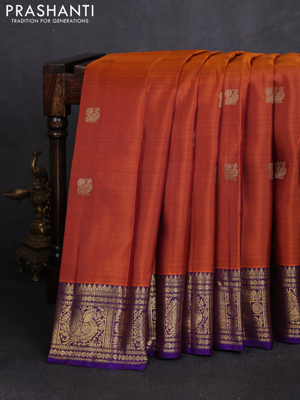 Pure kanchipuram silk saree rust shade and purple with zari woven buttas and rich zari woven border