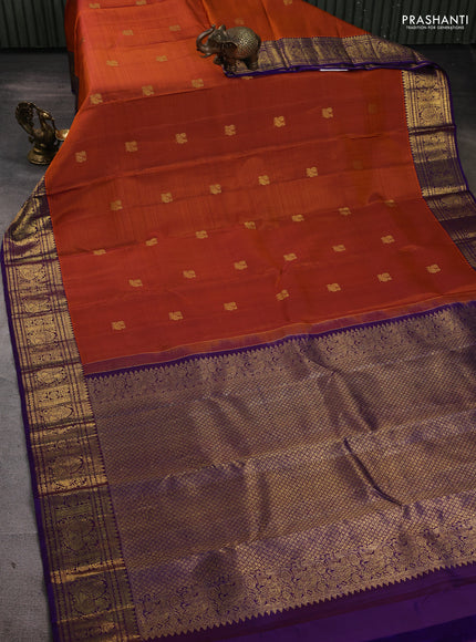 Pure kanchipuram silk saree rust shade and purple with zari woven buttas and rich zari woven border