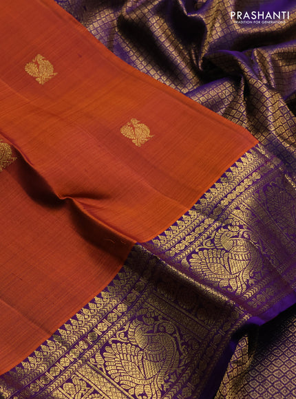 Pure kanchipuram silk saree rust shade and purple with zari woven buttas and rich zari woven border