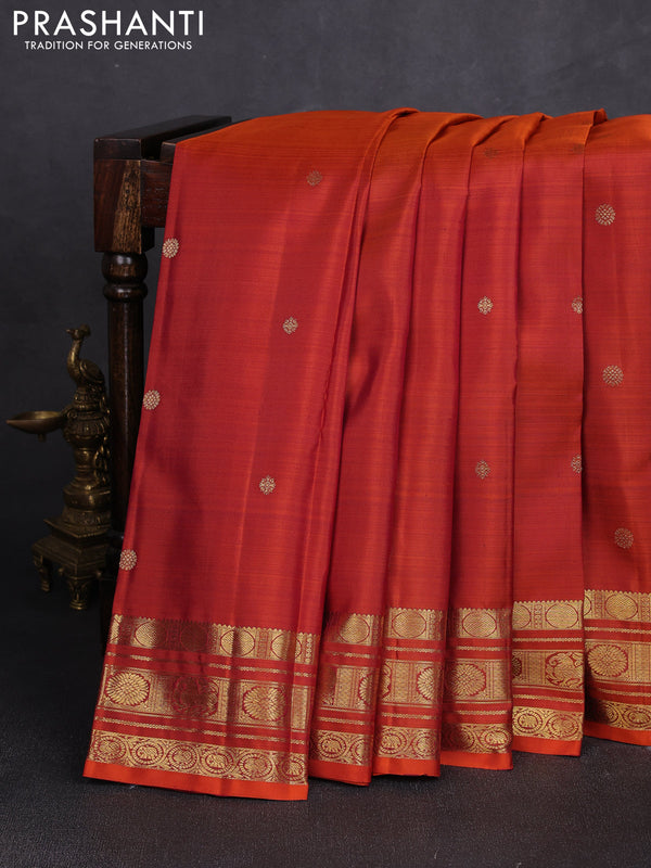 Pure kanchipuram silk saree rust shade with zari woven buttas and rich zari woven border