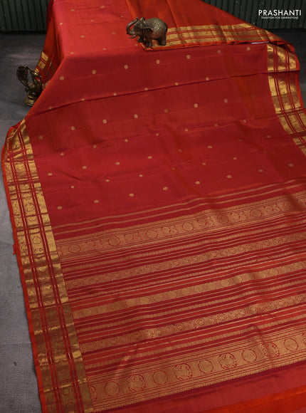 Pure kanchipuram silk saree rust shade with zari woven buttas and rich zari woven border