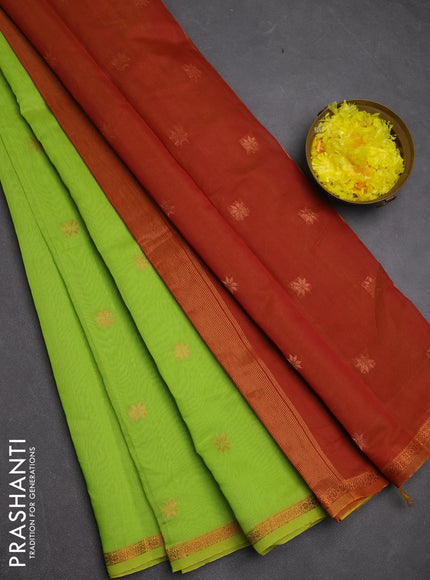 Semi maheswari cotton saree light green and rust shade with copper zari woven buttas and small copper zari woven border
