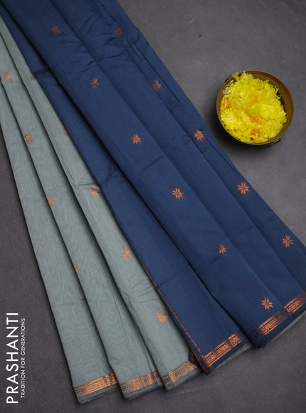 Semi maheswari cotton saree pastel green and grey shade with copper zari woven buttas and small copper zari woven border