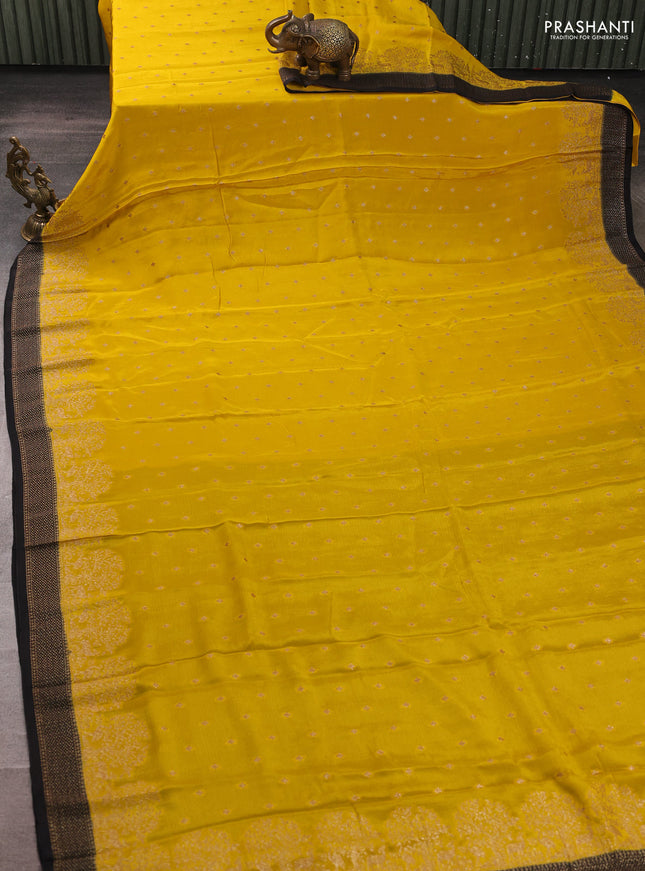 Banarasi semi chiffon saree mustard yellow and black with allover thread & zari woven buttas and woven border