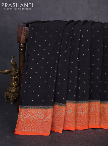 Banarasi semi chiffon saree black and orange with allover thread & zari woven buttas and woven border
