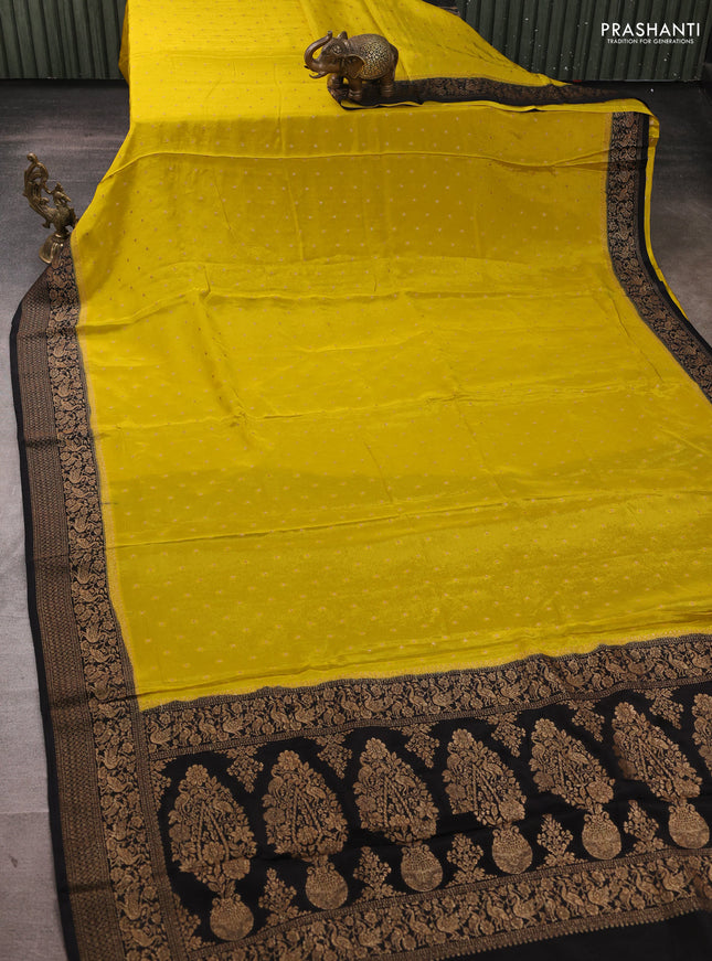 Banarasi semi chiffon saree mustard yellow and black with allover thread & zari woven buttas and woven border