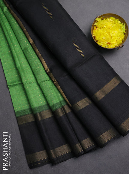Semi dupion saree light green and black with allover zari weaves and rettapet zari woven border